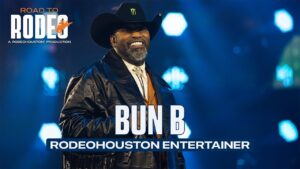 Bun B performing on stage at RodeoHouston with overlay text 'BUN B' and 'RODEOHOUSTON ENTERTAINER'