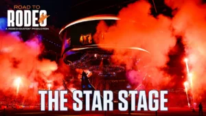 The Star Stage at RodeoHouston with red smoke, bright lights, and a circular rig overhead; Road to Rodeo branding visible at top left.